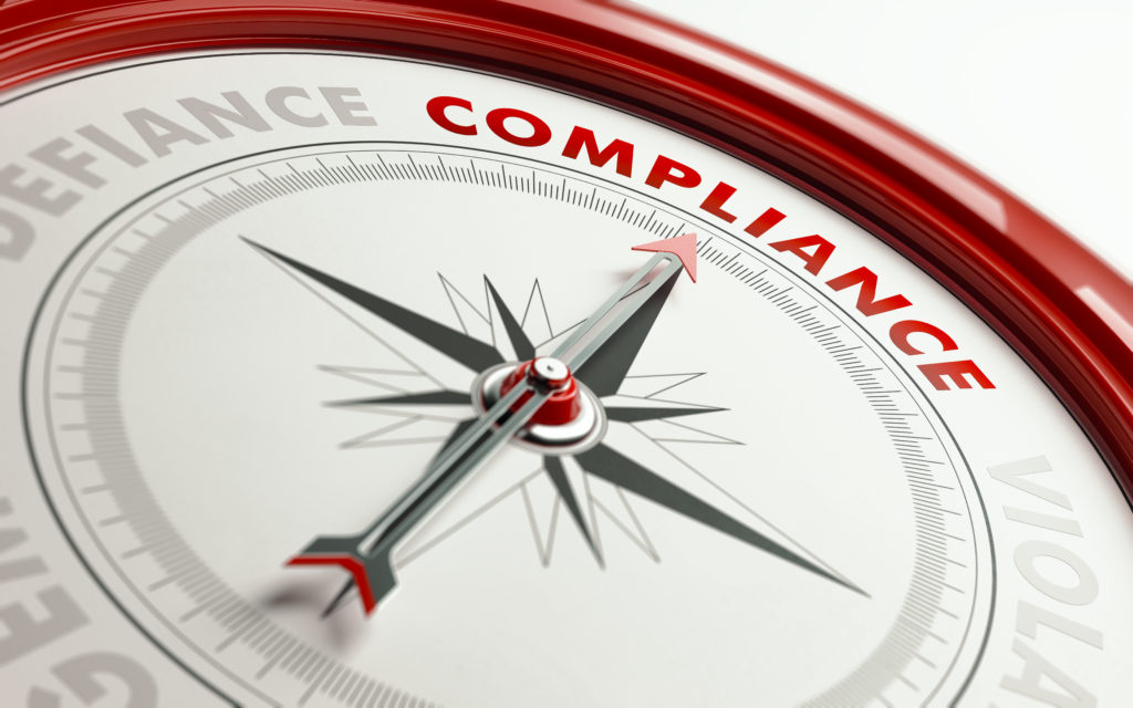 Compliance Concept: Arrow of A Compass Pointing Compliance Text