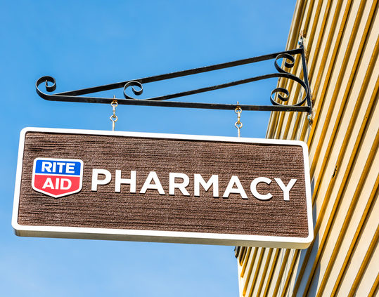 Rite Aid Pharmacy sign in old town village in Maine closeup isolated