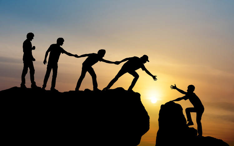 Group of people on peak mountain climbing helping team work , travel trekking success business concept trust image