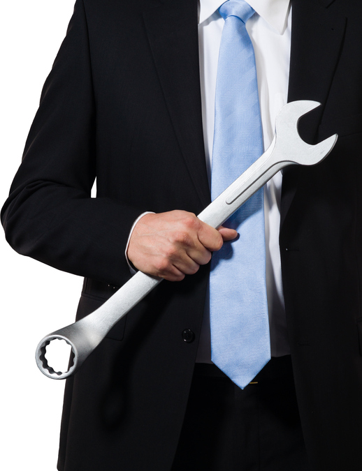 Manager holding wrench