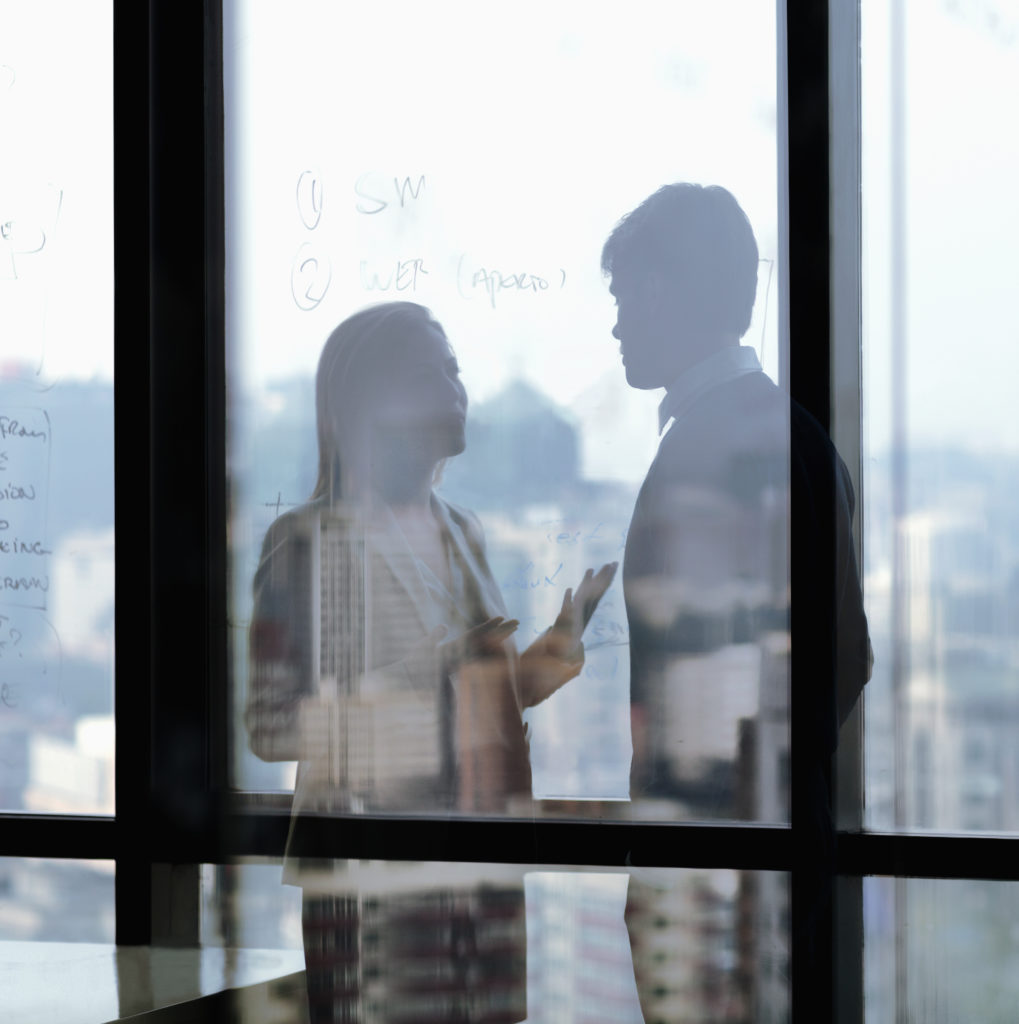 Silhouette shadows of business people talking in office