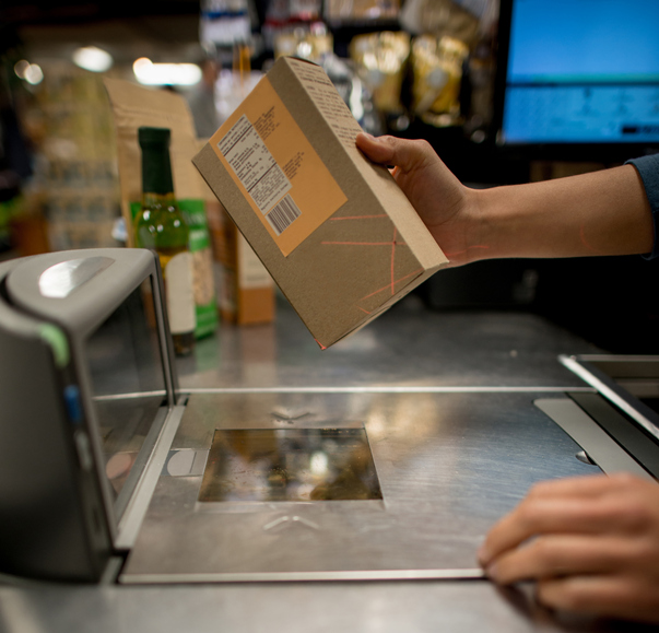 Cashier scanning a product at the supermarket