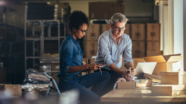Business partners preparing shipment to deliver to customer