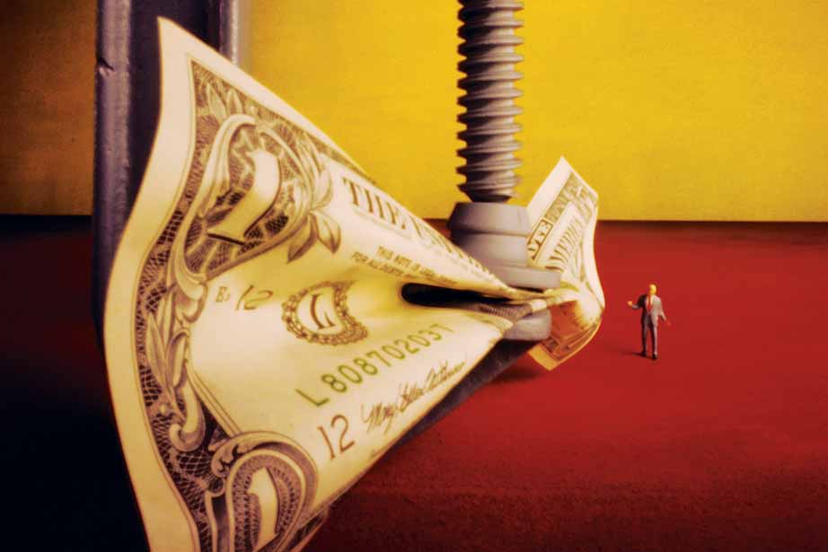 US dollar in clamp with figure of businessman alongside