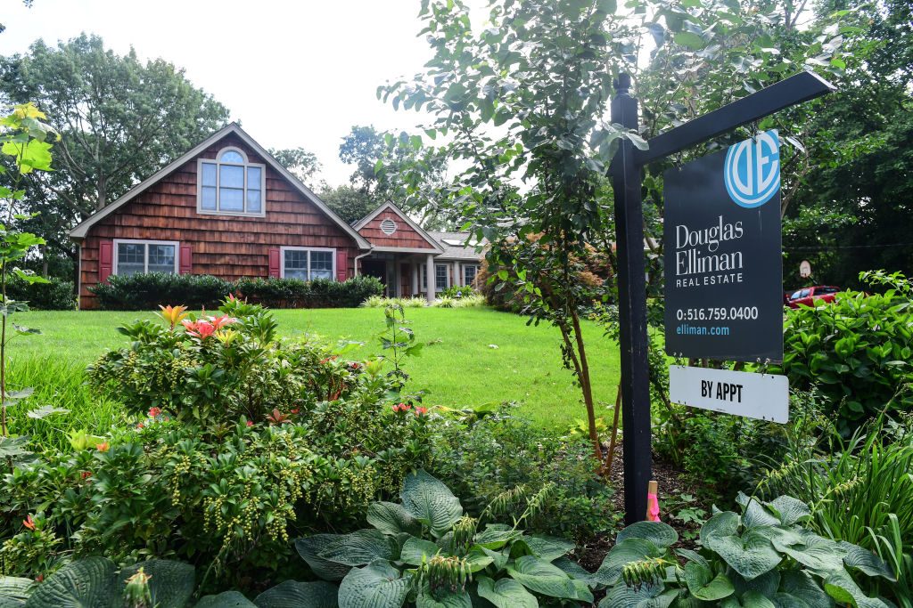 Photo of home with "for sale" sign on Long Island