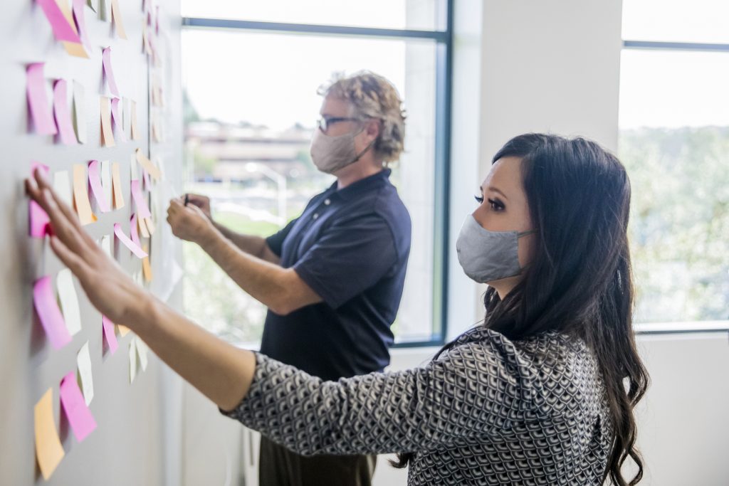 Business Leaders Brainstorming with Notes